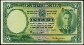 A single pinhole is observed and mentioned by PMG in the comments section of the holder. PMG About Uncirculated 55....$300-$500 10457 South African Reserve Bank. 10 Shillings, 18.9.1939. P-82d.