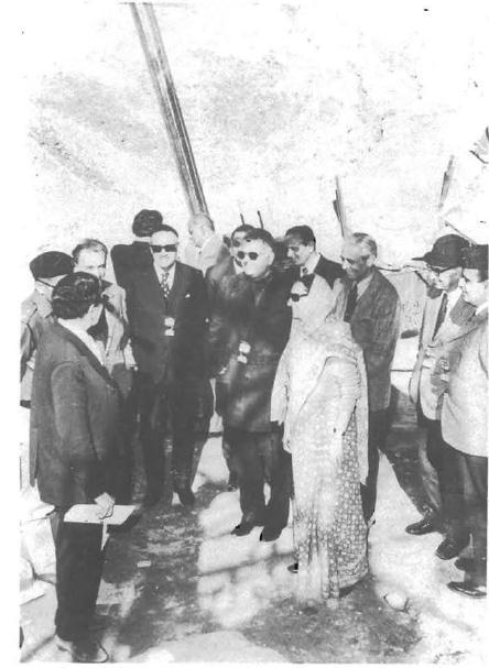 Figure 17: Satish Dhawan (third from right) behind Indira Gandhi. source: Weapons of Peace, Raj Chengappa.