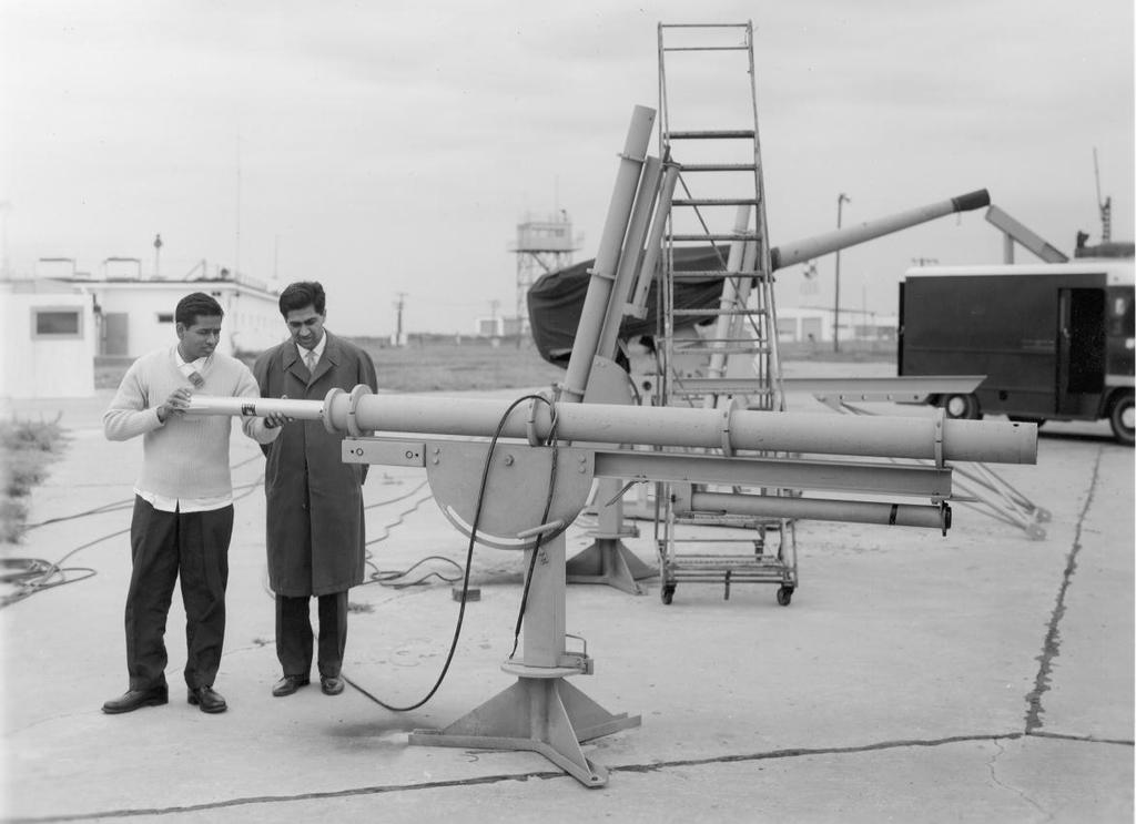 Figure 7. November 5, 1963: Indian and Pakistan nationals loading Judi-Dart into launcher. This is a part of their training in launching meterological rockets in connection with the IIOE.