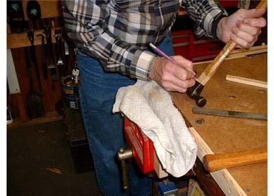 At the point it stops, take a pencil and mark around the head. Put the head back in the vise between wooden jaws and drive out the handle with stick and hammer.