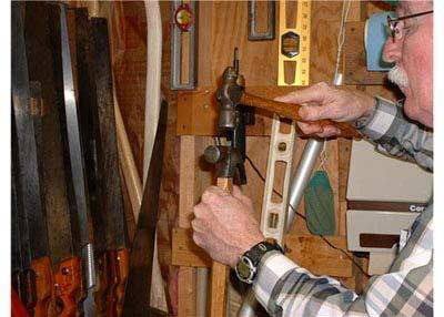 File the stub of the wedge and handle flush with the fine flat side of the rasp.