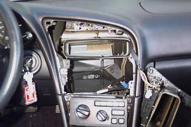 NOTE: notice that the face of the radio is flush or level with the pocket below it. This is important to remember when mounting the new radio in latter steps.