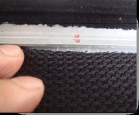 The black backing is held in place by the Velcro that is on