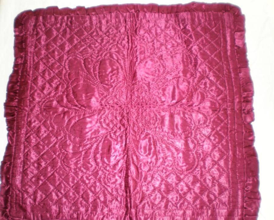 Crimson Quilted Cushion Age: 1930 s-1960 s Fabrics: Top: pink silk/rayon Backing: pink silk/rayon Wadding: thin cotton Construction: wholecloth, hand-quilted designs.