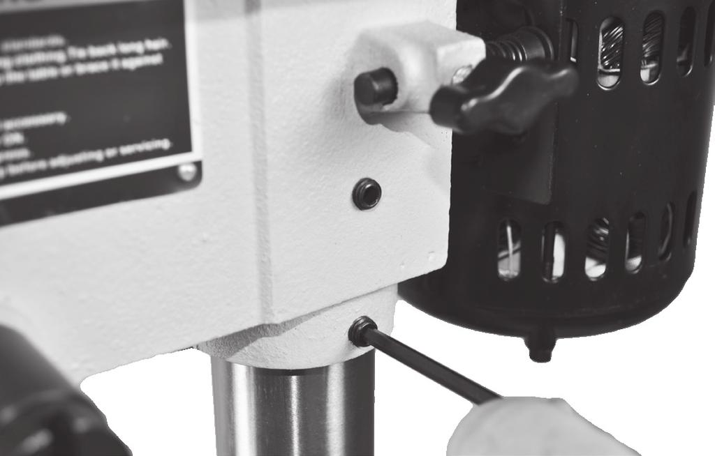 Tighten the drill press head into position by locking the two hex screws on