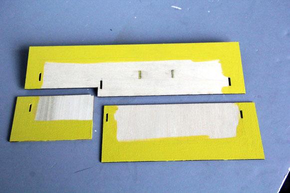 Paint the underside of the roof yellow as shown.