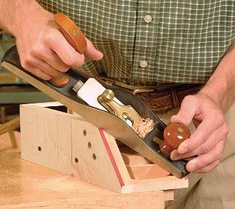 Once the glue has dried, plane the dovetails clean and flush, and turn your attention to the chest s lid.