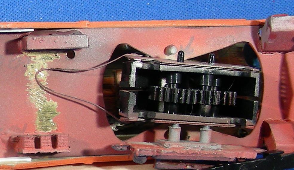 On this model I tried something similar with the drive truck. A loop of PB wire is soldered to each of the pickup pieces then bent to rub the floor when the car is on the track.