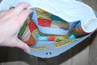 place the outside of the bag (which is right side out) inside the lining (which is inside out) and line up the edges.
