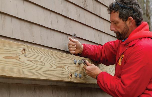 An additional bead of caulk can be applied between the siding and the bracket s web. My associate, Mac, and I spaced the deck brackets on approximate 40-in.