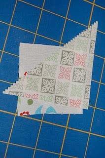 be sure that when you fold it over it will cover the white part of the square completely) and sew