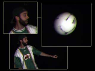 The warped images are blended using the same weights as in the center image. No double images are present because parallax and motion for the ball are correctly recovered. image. However, the occluder is not rendered invisible, and the synthetic aperture photograph attenuates the signal of interest, i.