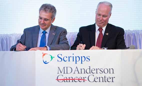 MD Anderson President Ronald A. DePinho, MD, and Scripps President and CEO Chris Van Gorder sign the historic partnership agreement to create Scripps MD Anderson Cancer Center.