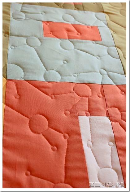 For each of the left and right borders, sew together one and a half strips and trim them to a length of 51 1/2. Sew these to side edges of quilt center.