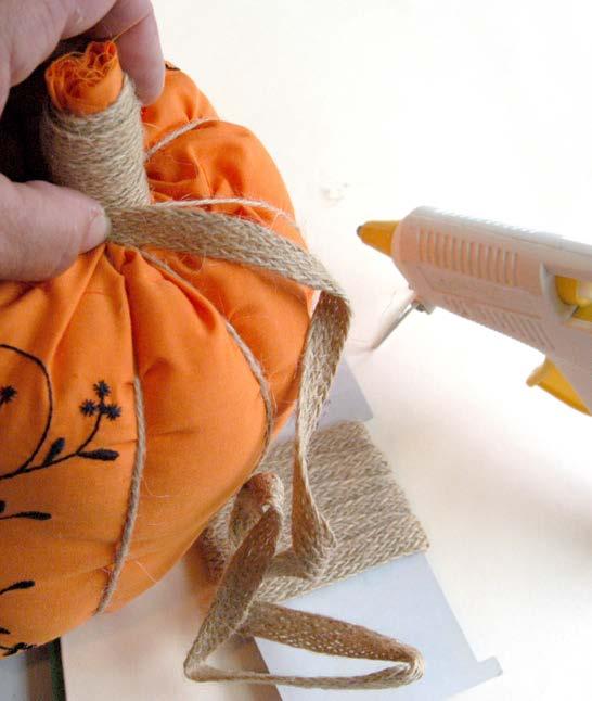 The stem is formed by wrapping the extending fabric stem with flat Jute cord: Decide on the final stem height and thickness. Suggestions are at the end of the directions depending on pumpkin size.