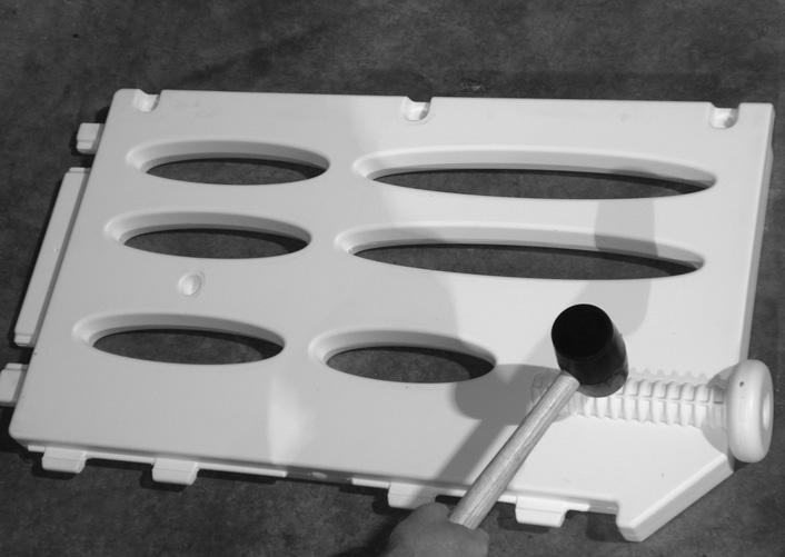 #2: Next install one of the leveler tube assemblies into the lower side panel leaving