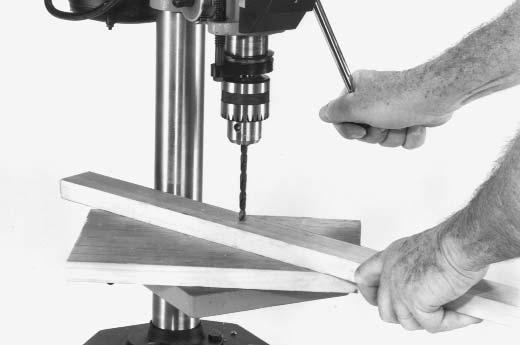 Do not use hand bits which have a screw tip; at drill press speeds, they turn into the wood so rapidly as to lift the work off the table and whirl it.