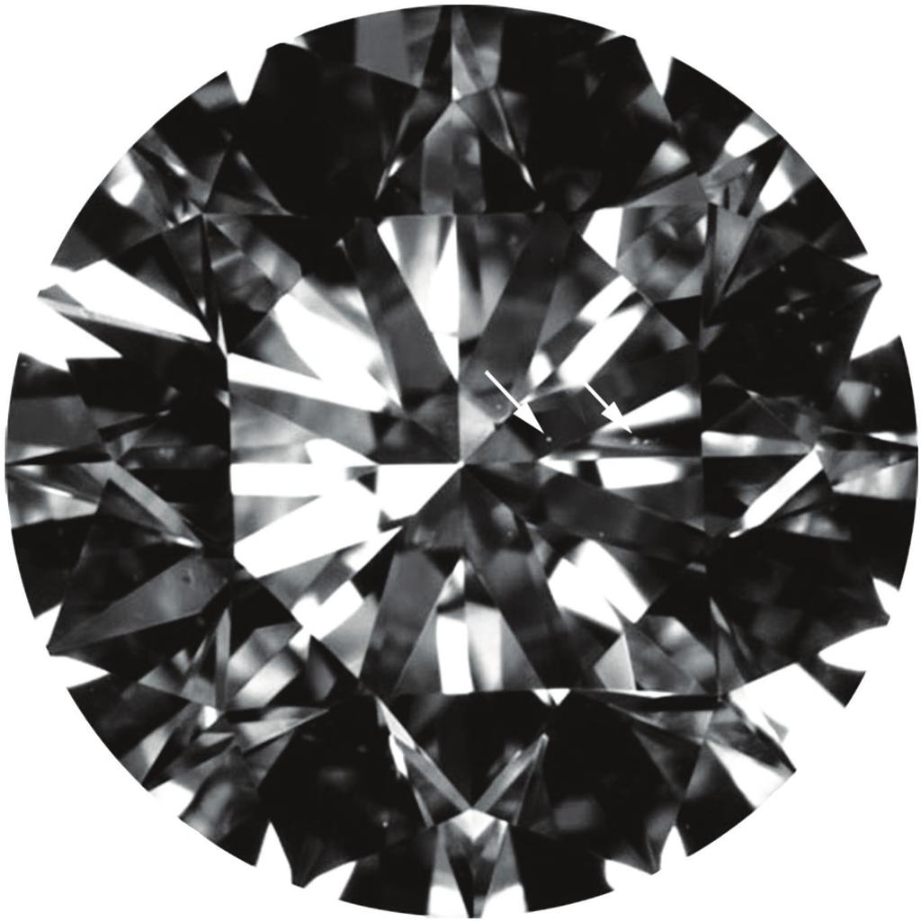 a Figure 17: (a) This large VS 2 -graded diamond (570 ct, 1148 1153 713 mm) contains a string of five tiny crystals that taken together have the combined area of a VS 2 The plot from its GIA report