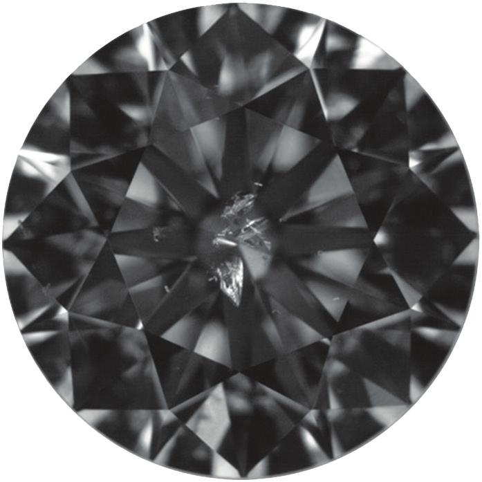a b Figure 19: Shown with darkfield illumination (a) and overhead lighting (b), this 074 ct SI 2 -graded diamond (580 582