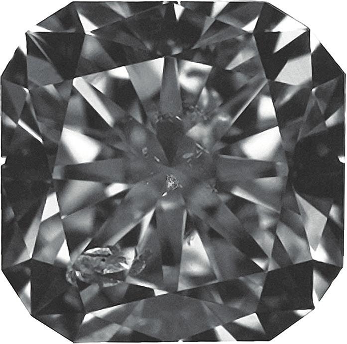 illumination (a) and overhead lighting (b), this 101 ct I 1 -graded diamond (585 589 385 mm) contains a large I 1 -size