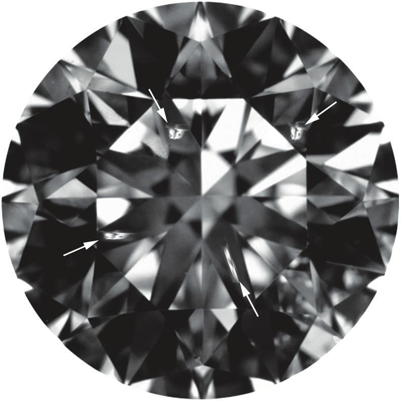 contrast, and thus similar noticeability Each has an area determined to be approximately 35,000 µm 2 Figure 5: This 070 ct diamond (574 571 352 mm) contains four VS 2 -size inclusions between the 10