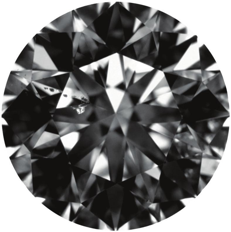 Figure 7: This 111 ct SI 2 -graded diamond (666 663 411 mm) contains a white crystal and a string of five smaller dark-appearing inclusions, for a combined clarity grade of high SI 2 Figure 8: