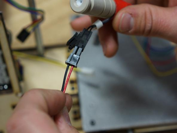 Plug hot end power extension into "EXTRUDER" on board.