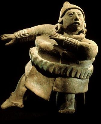 National Museum of Anthropology, Mexico. This ballplayer is in one of the classical ballplaying stances as he kneels down on one leg to receive the bouncing ball with his hip.