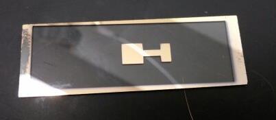 This involved performing a peel-off test in which a piece of tape was applied to the sputtered surface, pressed down evenly, and removed.