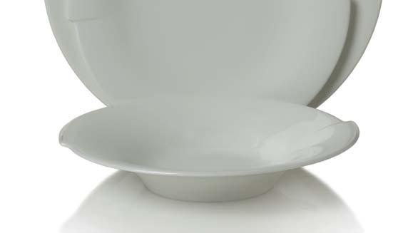 A four-piece place setting includes a dinner plate, a salad plate, a soup bowl and a
