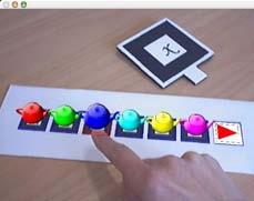 Figure 11 shows a simple game in which users can push the virtual balls with their bare hands.
