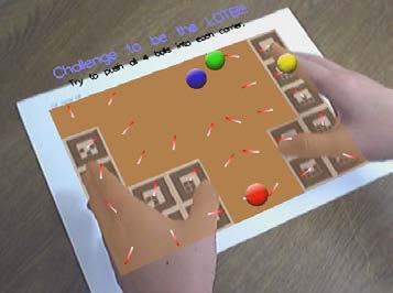 7) for ease using. The ball pushing game, the tic-tac-toe (see Figure 10) and the Tangible AR calculator were demonstrated on a public.