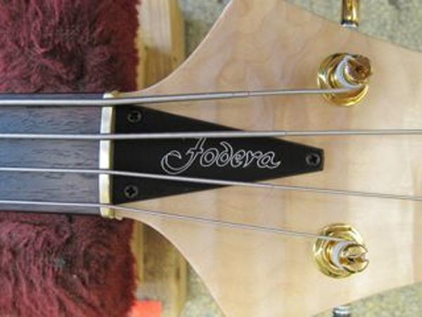 1. Begin by locating the Truss Rod Cover. 2.