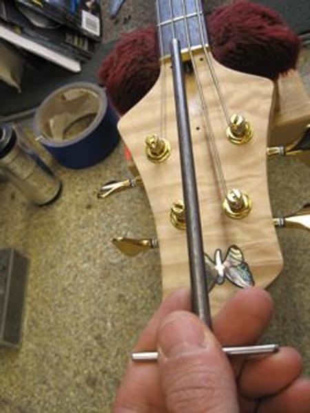Completely loosen the nut using the Truss Rod