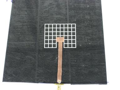 21 Fig. 2.7: Example of a fabricated meshed patch antenna that has been matched to the feed with the insert feed method.