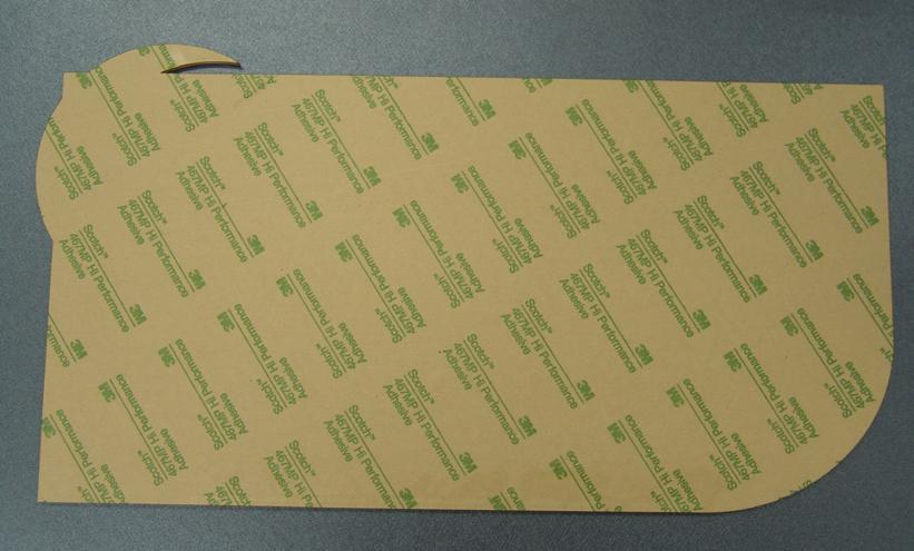 Remove the protective paper from one side of a 1/8 sheet of acrylic and apply a sheet of double-sided adhesive