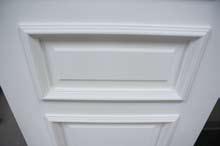 MDF panel captured by raised architectural moulding.