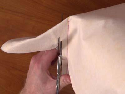 Sew a seam across the lines. Trim each corner leaving 1/2" excess.