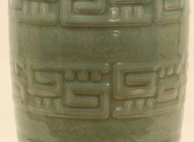 8 cm; Private collection The body of this vase has a molded design of three bold horizontal rows of a modified