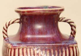 2 cm; Private collection The blue-infused red glaze on this unusually shaped vase covers the shoulders and inner neck and falls