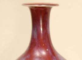 5 cm; Private collection Covered with a lustrous red glaze suffused with blue streaks, the glaze falls to an unglazed foot,