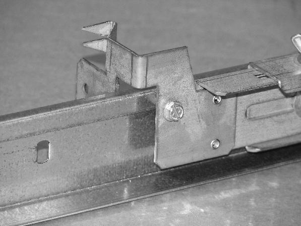 (See Figs. 13 & 15) Lock the rails in place with the supplied self-threading screws.