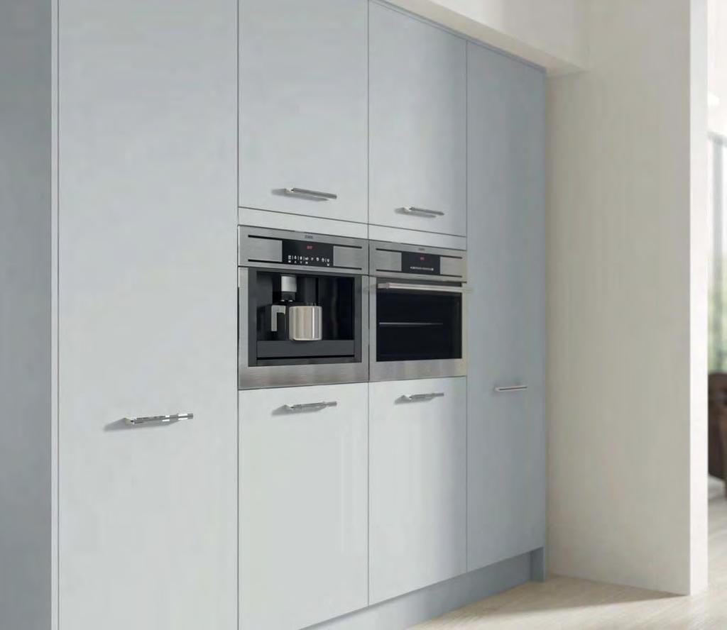 PAINTED PLATINUM Above: A combination of tall cabinets such as larder, fridge freezers and oven