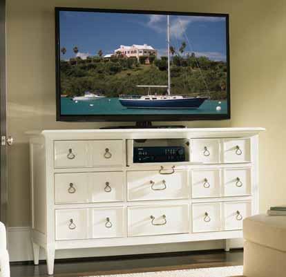 The 9-drawer Grotto Isle dresser features a drop front on the top center