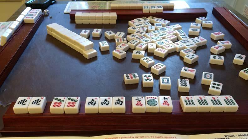 MAH JONGG Developed in China Likely invented in the mid 1800s Although some legends say it was invented as early as 500 BC Used to pass time Likely started