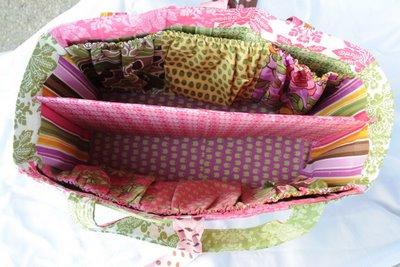 this fun diaper bag! It is made from 1 charm pack and 1 layer cake.