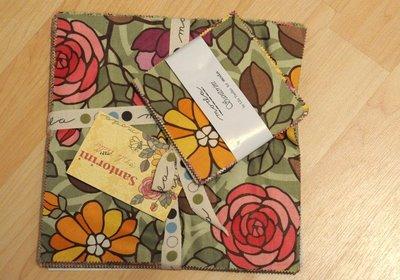 Ingredients: 1 Charm Pack- I used Santorini by Lila Tueller 1 Layer Cake Fusible Fleece Timtex/Peltex (fusible) Heavy Weight Fusible Interfacing (I used fuse-a-shade) Wide ribbon Garnishes