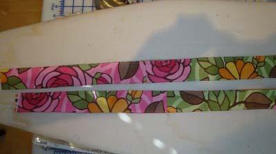 Sew 1 handle piece (with out interfacing) to one with interfacing. Sewing along one long side.