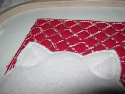 Cut a piece of thin pink fabric.