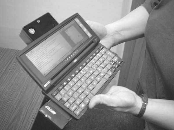 Fig.3. The prototype receiver in use with a handheld computer.